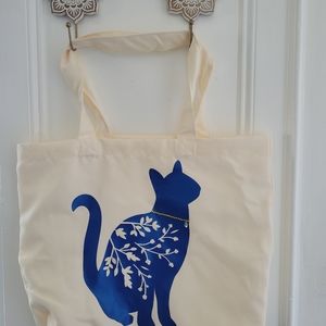 White tote bag with cat graphic